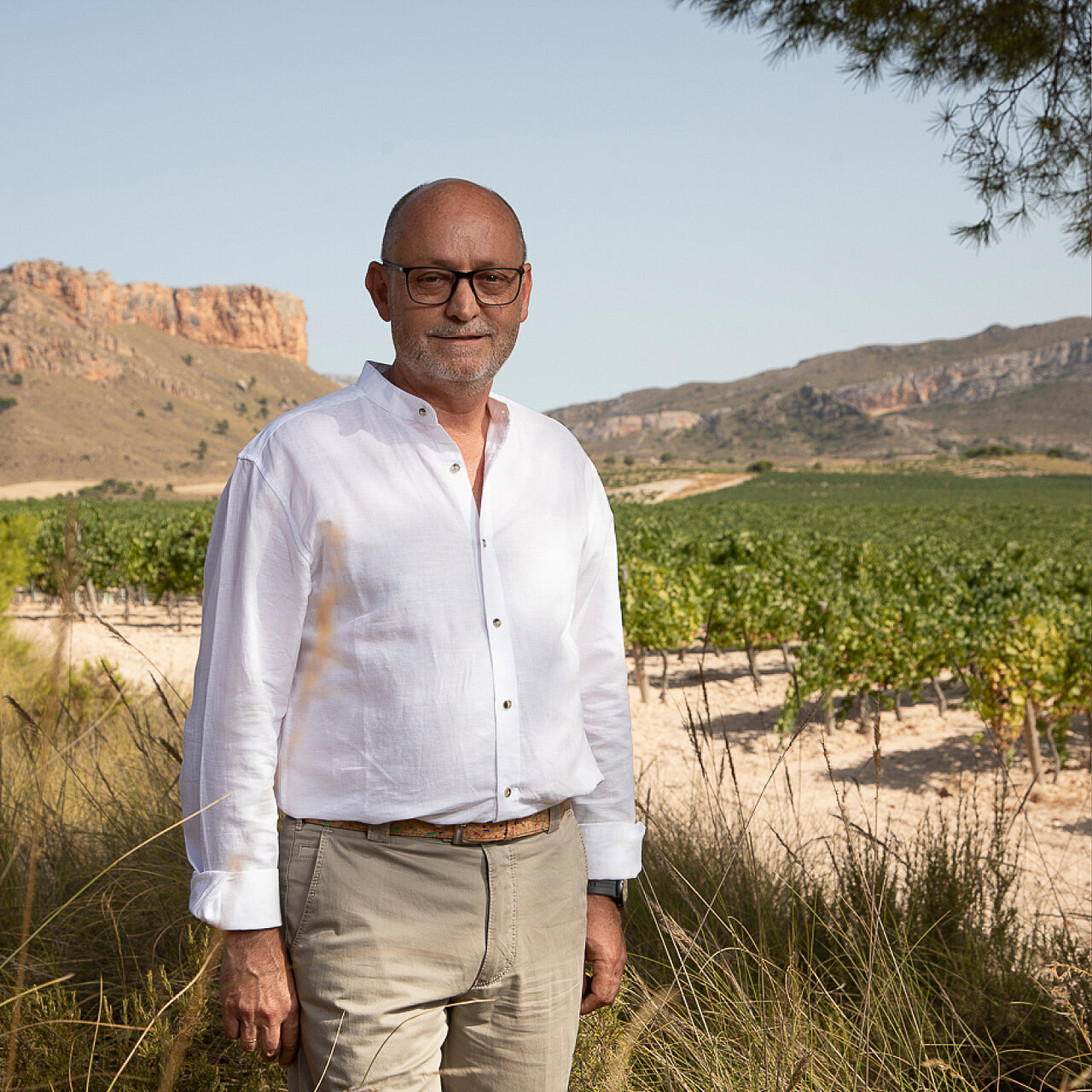 Representatives of the Familia Gil winery in a vineyard.